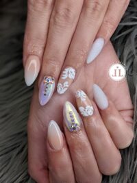 Decorative nail art design from Little Luxuries Nail Lounge with stone embellishments