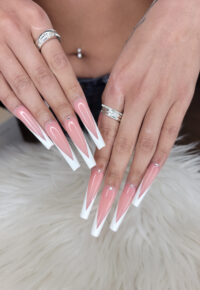 Long nails with decorative french manicure design from Little Luxuries Nail Lounge