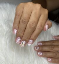 Nail art manicure with white and gold foil design from Little Luxuries Nail Lounge