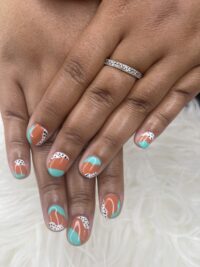 Nail art design manicure in blue, orange and black and white dots from Little Luxuries Nail Lounge